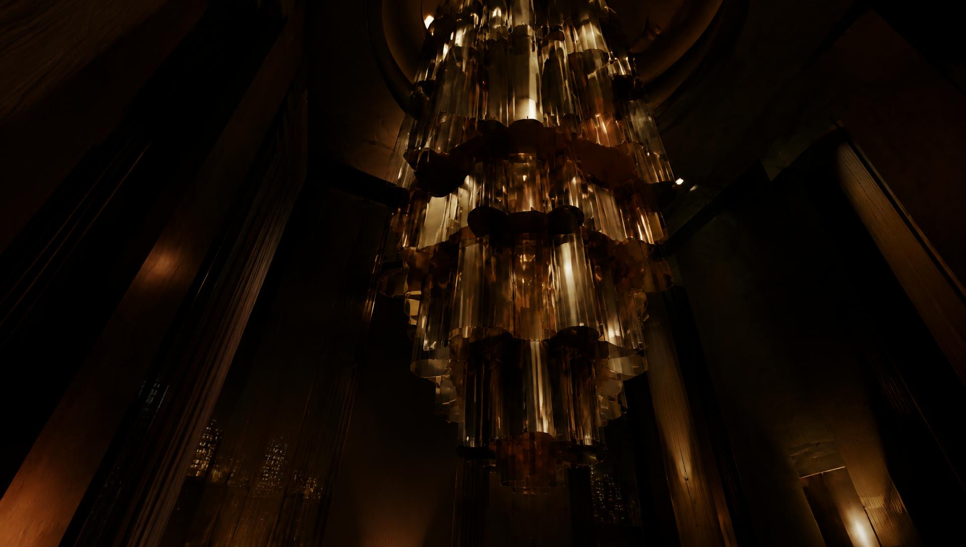Looking up into a towering smoked-bronze and glass chandelier in a very tall ceiling